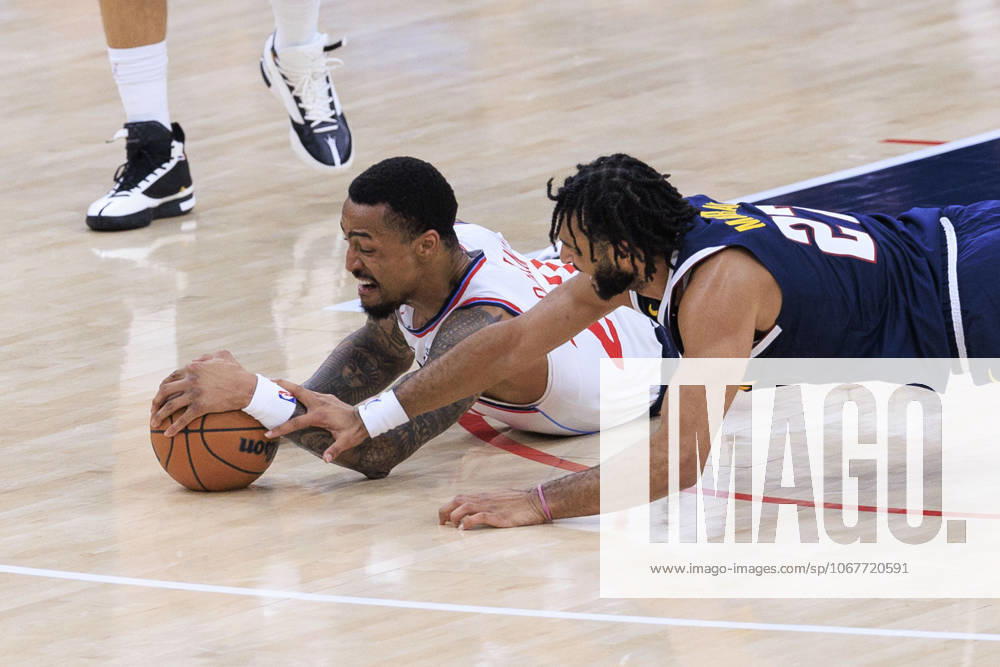 Jamal Murray 27 of the Denver Nuggets and John Collins 20 of the Los Angeles Clippers struggle for possession of the ball during their preseason NBA, Basketball Herren, USA game on Sunday October 12, 2025 at Intuit Dome in Inglewood, California. Clippers lose to Nuggets, 94-102. ARIANA RUIZ PI Inglewood USA - ZUMAp124 20251012_zaa_p124_087