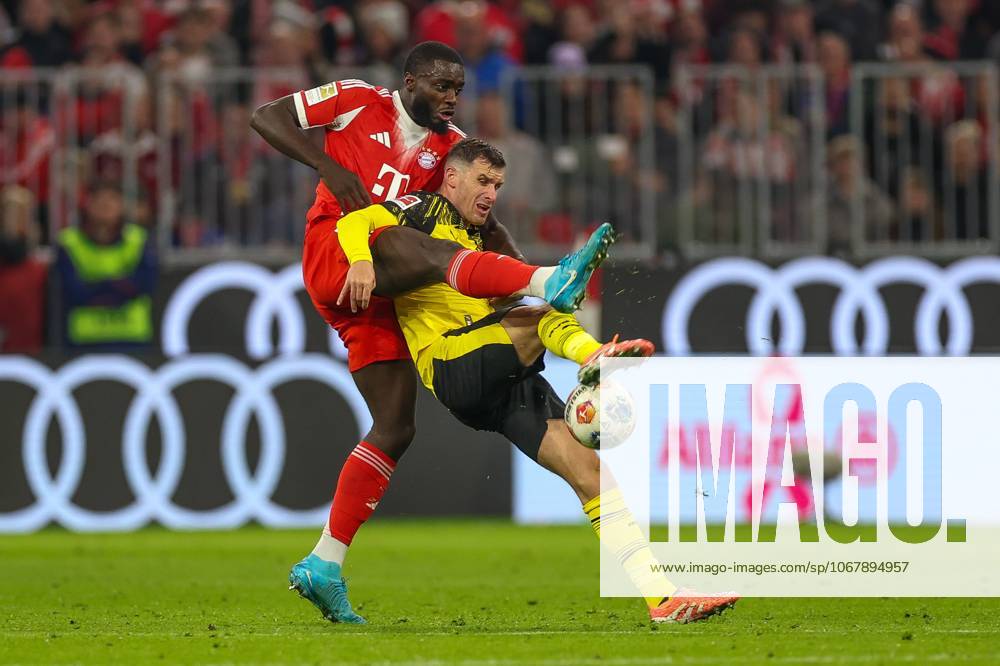 In duel, action, with Dayot Upamecano 2 FC Bayern Muenchen , Pascal Gross 13 Borussia Dortmund , FC Bayern Muenchen vs Borussia Dortmund, Football, 1 Bundesliga, 7 Matchday, 18 10 2025 DFB regulations prohibit any use of photographs as image sequences and or quasi video Muenchen Bayern Germany