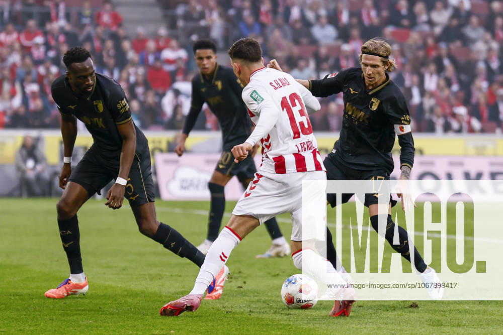 Said el Mala (1. FC Koeln, 13) fighting against three defenders of Augsburg, on the left Chrislain Matisma (FC Augsburg, 5), on the right Kristijan Jakic (FC Augsburg, 17), in the back Noahkai Banks (FC Augsburg, 40) during the Bundesliga match between 1. FC Koeln vs. FC Augsburg at the Rheinenergie-Stadion on matchday 7 of the 1. Bundesliga on October 18, 2025 in Koeln, Germany. DFL REGULATIONS PROHIBIT ANY USE OF PHOTOGRAPHS AS IMAGE SEQUENCES AND OR QUASI-VIDEO. Nordrhein-Westfalen Germany