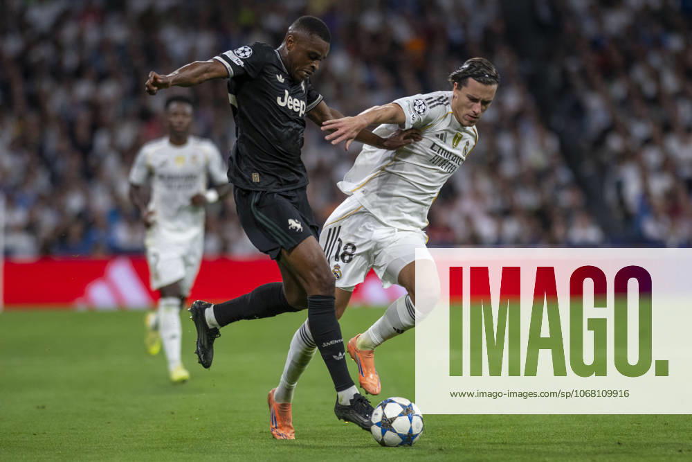 ALVARO CARRERAS of Real Madrid CF and PIERRE KALULU of Juventus de Turin in action during the match on the third day of the group stage of the 2025 26 UEFA Champions League between REAL MADRID C.F. vs JUVENTUS DE TURIN, played at the Santiago Bernabeu Stadium on October 22, 2025, in Madrid, Spain. Madrid Spain - ZUMAc312 20251023_zsp_c312_041