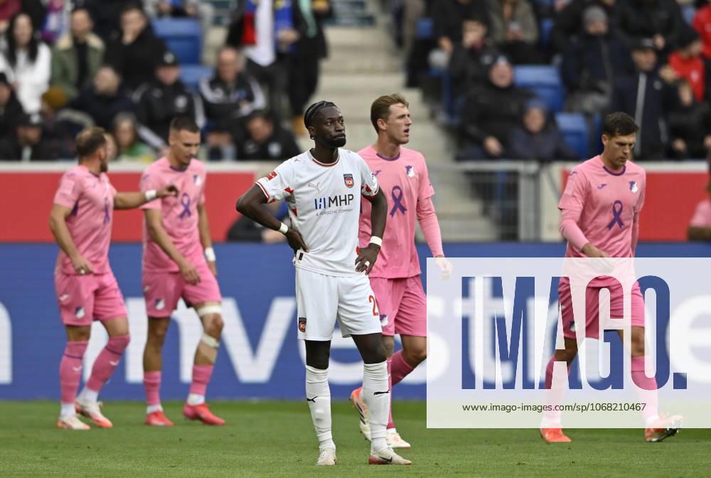 GOAL for 1 0 Fisnik Asllani TSG 1899 Hoffenheim 11 goal celebration Pink violet jersey special jersey campaign TOGETHER AGAINST BREAST CANCER TSG 1899 Hoffenheim in the background perimeter advertising logo front Omar Haktab Traore 1 FC Heidenheim 1846 FCH 23 disappointed TSG 1899 Hoffenheim vs 1 FC Heidenheim 1846 FCH 25 10 2025 DFL REGULATIONS PROHIBIT ANY USE OF PHOTOGRAPHS AS IMAGE SEQUENCES AND OR QUASI VIDEO TSG 1899 Hoffenheim vs 1 FC Heidenheim 1846 FCH