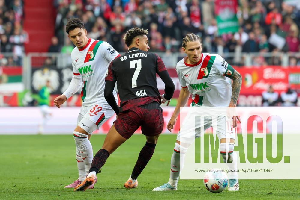 In duel, action, with Fabian Rieder 32 FC Augsburg , Antonio Nusa 7 RB Leipzig , Kristijan Jakic 17 FC Augsburg , FC Augsburg vs RB Leipzig, Soccer, 1 Bundesliga, 8 Matchday, 25 10 2025 DFB regulations prohibit any use of photographs as image sequences and or quasi video Augsburg Bayern Germany