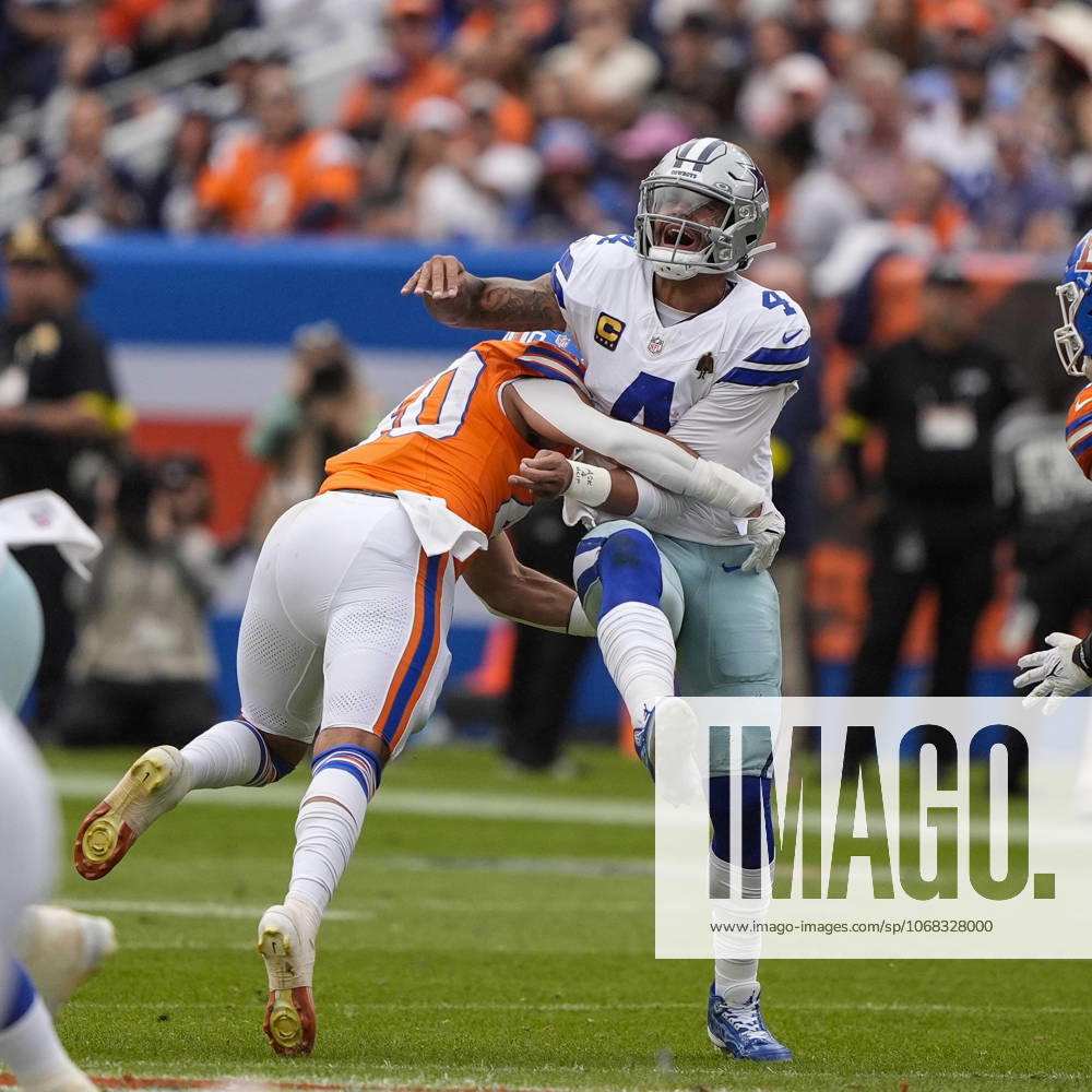 Dallas Cowboys quarterback Dak Prescott (4) grimaces after being hit by Denver Broncos linebacker Justin Strnad (40) in the first half of the football game between the Denver Broncos and Dallas Cowboys. CSM. - ZUMAc04_ 20251026_zma_c04_205