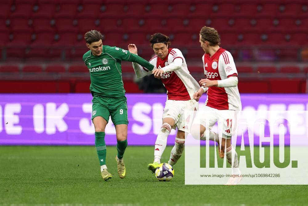 , JohanCruyff Arena , season 2025 2026 , Dutch Eredivisie Football , match between Ajax and FC Groningen (replay) , Picture shows , FC Groningen player Brynjolfur Willumsson, Ajax player Ko Itakura, .Ajax player Mika Godts Ajax - Groningen (replay) x32313326x