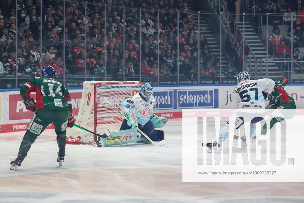 In duel, action, with D J Busdeker 14 Augsburger Panther , goaltender Janick Schwendener Dresdner Eisloewen 62 , Emil Johansson Dresdner Eisloewen 57 , Augsburger Panther vs Dresdner Eisloewen, 25 Matchday, Ice Hockey, Penny DEL, 04 12 2025 Augsburg Bayern Germany