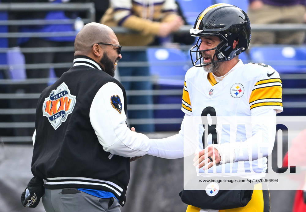 Pittsburgh Steelers quarterback Aaron Rodgers (8) greets an acquaintance during warmups before facing the Baltimore Ravens at M&T Bank Stadium in Baltimore, Maryland, on Sunday, December 7 2025. BAL20251207104 DAVIDxTULIS