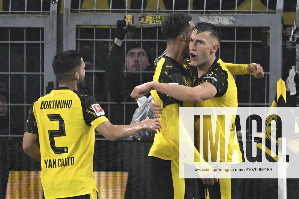 Nico Schlotterbeck Dortmund 4 celebrates after scoring 2 0 with Felix Nmecha Dortmund 8 Yan Couto Dortmund 2 07 12 2025 Football Borussia Dortmund vs TSG Hoffenheim, Signal Iduna Park, Dortmund, DFB DFL REGULATIONS PROHIBIT ANY USE OF PHOTOGRAPHS AS IMAGE SEQUENCES AND OR QUASI VIDEO