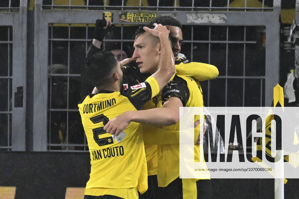 Nico Schlotterbeck Dortmund 4 celebrates after scoring 2 0 with Felix Nmecha Dortmund 8 Yan Couto Dortmund 2 07 12 2025 Football Borussia Dortmund vs TSG Hoffenheim, Signal Iduna Park, Dortmund, DFB DFL REGULATIONS PROHIBIT ANY USE OF PHOTOGRAPHS AS IMAGE SEQUENCES AND OR QUASI VIDEO
