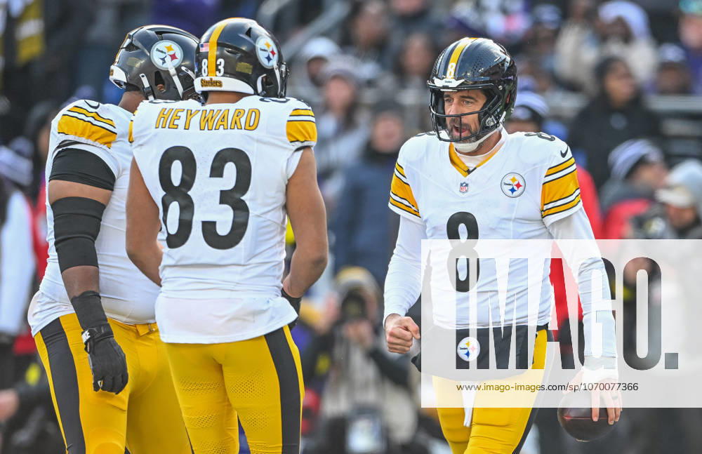 Pittsburgh Steelers quarterback Aaron Rodgers (8) clenches his fist after scoring on a one yard run against the Baltimore Ravens as tight end Connor Heyward (83) greets him during the first quarter at M&T Bank Stadium in Baltimore, Maryland, on Sunday, December 7 2025. BAL20251207122 DAVIDxTULIS