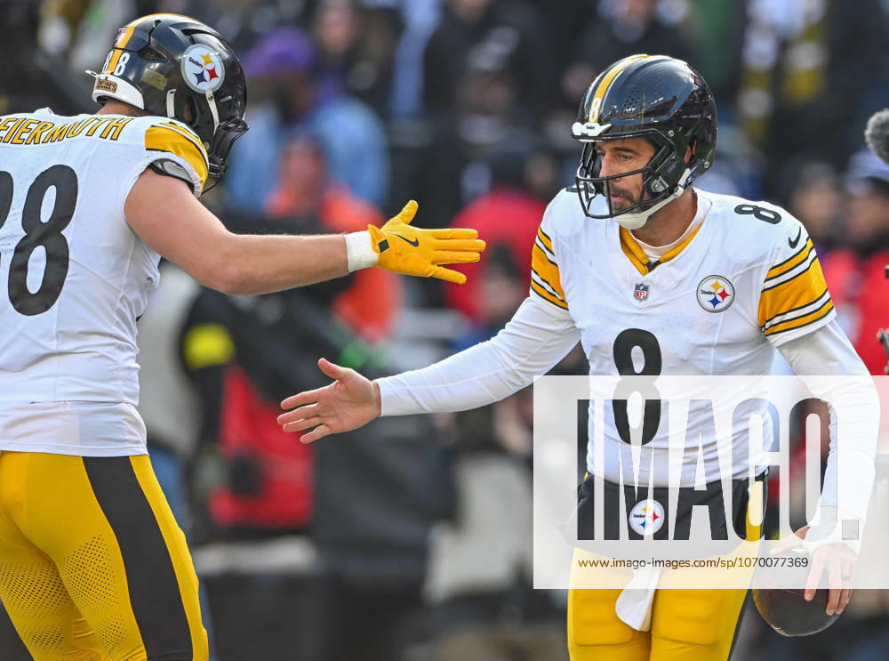 Pittsburgh Steelers quarterback Aaron Rodgers (8) celebrates with tight end Pat Freiermuth (88) after scoring on a one yard run against the Baltimore Ravens during the first quarter at M&T Bank Stadium in Baltimore, Maryland, on Sunday, December 7 2025. BAL20251207123 DAVIDxTULIS