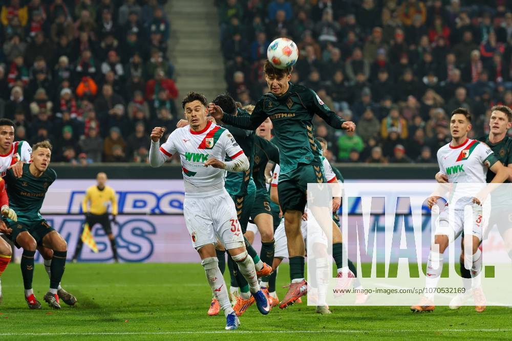 In duel, action, with Fabian Rieder 32 FC Augsburg , Niklas Stark 4 SV Werder Bremen , FC Augsburg vs SV Werder Bremen, Soccer, 1 Bundesliga, 15 Matchday, 20 12 2025 DFB regulations prohibit any use of photographs as image sequences and or quasi video Augsburg Bayern Germany