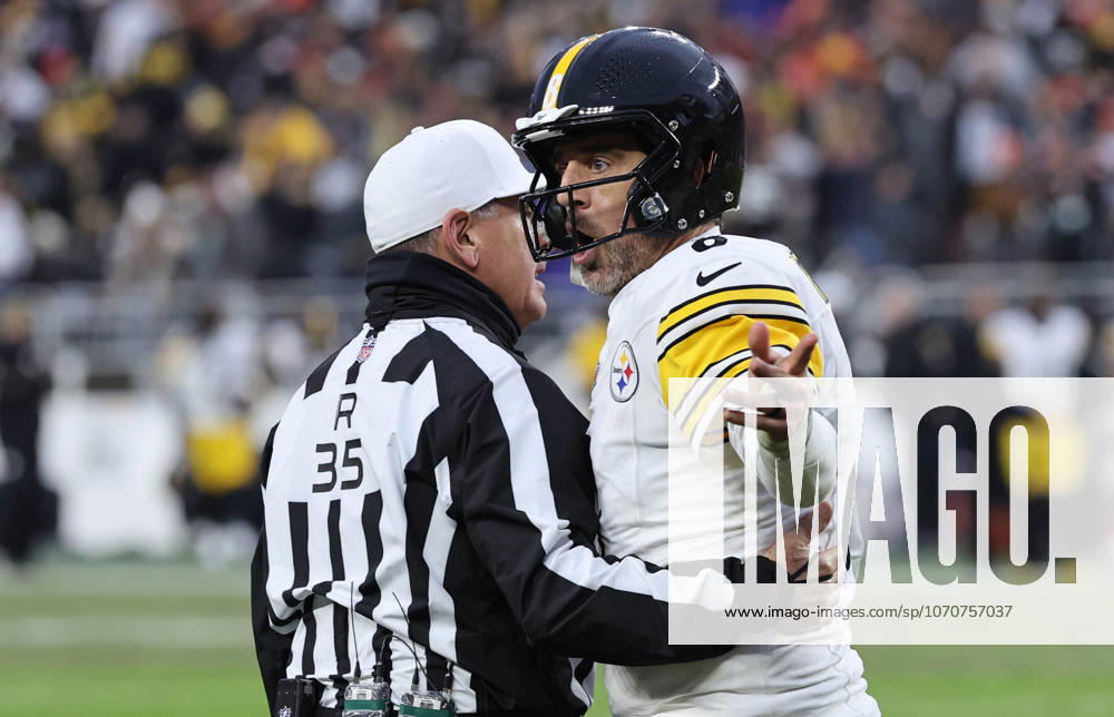 Pittsburgh Steelers quarterback Aaron Rogers (8) is held back by referee John Hussey (35) as he argues with the Cleveland Browns sideline after an incomplete pass on fourth down during the fourth quarter at Huntington Bank Field in Cleveland, Ohio on Sunday December 28, 2025. CLE20251228115 AARONxJOSEFCZYK