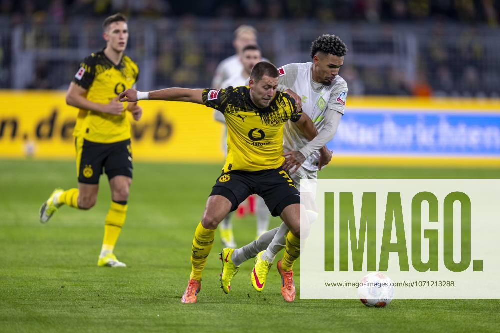 Football Borussia Dortmund SV Werder Bremen, Matchday 17 at Signal Iduna Park Waldemar Anton Borussia Dortmund l and Justin Njinmah Werder Bremen fight for the ball IMPORTANT NOTICE According to the regulations of the DFL and the DFB, it is prohibited to use or have used photographs taken in the stadium and or of the match in the form of sequential images and or video-like photo series