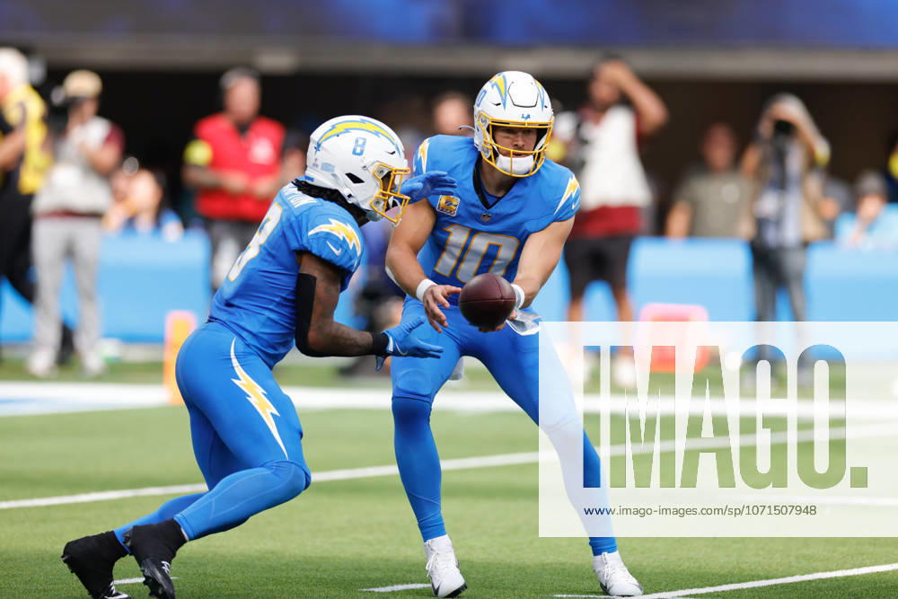 INGLEWOOD, CA - OCTOBER 5: Los Angeles Chargers quarterback Justin Herbert (10) hands off to Los Angeles Chargers running back Omarion Hampton (8) during the NFL, American Football Herren, USA game between the Washington Commanders and the Los Angeles Chargers on October 05, 2025, at SoFi Stadium in Inglewood, CA. (Photo by Jevone Moore Icon Sportswire) NFL: OCT 05 Commanders at Chargers Icon20251005022