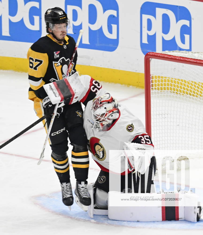Pittsburgh Penguins right wing Rickard Rakell (67) receives a goalie Interference penalty as he collides with Ottawa Senators goaltender Linus Ullmark (35) during the first period at PPG Paints Arena in Pittsburgh on Monday, February 2, 2026. PIT2026020206 ARCHIExCARPENTER