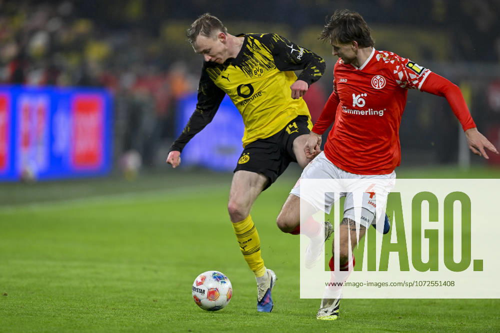 From left in duel Maximilian Beier Dortmund 14 Stefan Posch Mainz 4 13 02 2026 Soccer Borussia Dortmund vs 1 FSV Mainz 05, Signal Iduna Park, Dortmund, DFB DFL REGULATIONS PROHIBIT ANY USE OF PHOTOGRAPHS AS IMAGE SEQUENCES AND OR QUASI VIDEO