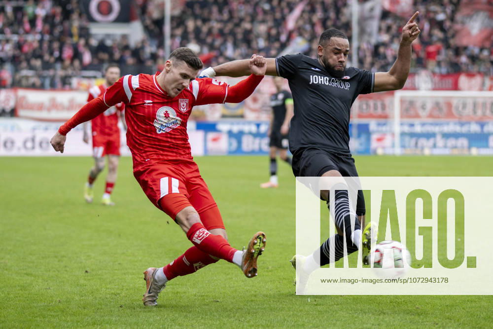 Regionalliga Nordost Season 25 26 Hallescher FC vs Greifswalder FC Halle, Germany February 21, 2026 In the picture from left in the duel Marius Hauptmann Halle and Jason Tomety Hemazro Greifswald Halle Saale Leuna Chemie Stadium Saxony Anhalt Germany