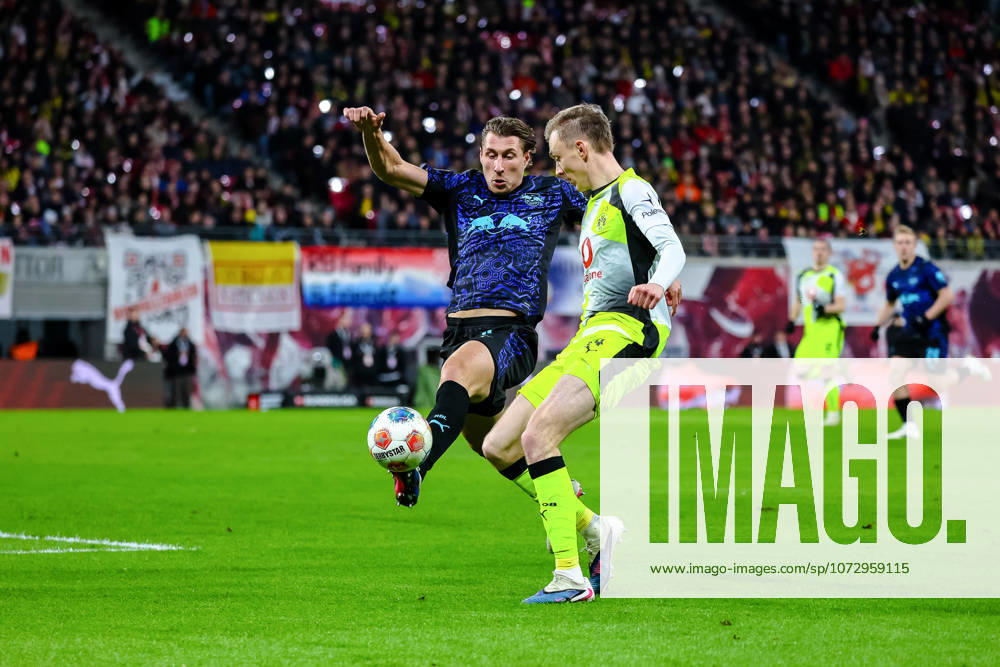 Willi Orban RB Leipzig, 04 on the ball, duel, duel, fight with Maximilian Beier Borussia Dortmund, 14 , RB Leipzig vs Borussia Dortmund, Football, 1 Bundesliga, 23 Matchday, Season 2025 2026, 21 02 2026,¨ DFL REGULATIONS PROHIBIT ANY USE OF PHOTOGRAPHS AS IMAGE SEQUENCES AND OR QUASI VIDEO,¨ RB Leipzig vs Borussia Dortmund, Football, 1 Bundesliga, Matchday 3, Season 2025 2026, 21 02 2026 Leipzig