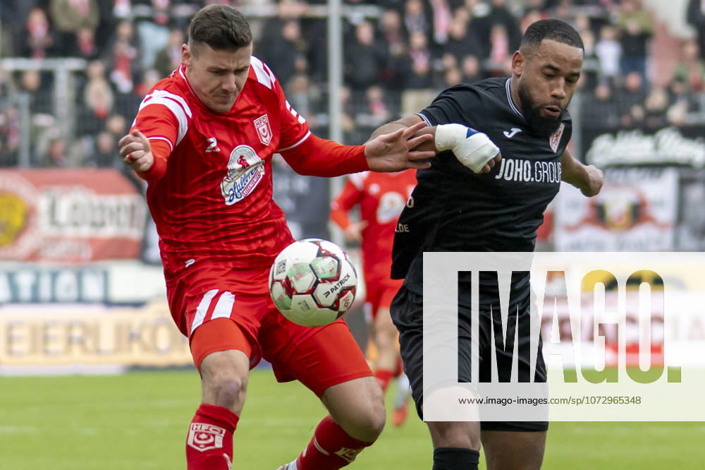 Regionalliga Nordost Season 25 26 Hallescher FC vs Greifswalder FC Halle, Germany February 21, 2026 In the picture from left in the duel Marius Hauptmann Halle and Jason Tomety Hemazro Greifswald Halle Saale Leuna Chemie Stadium Saxony Anhalt Germany