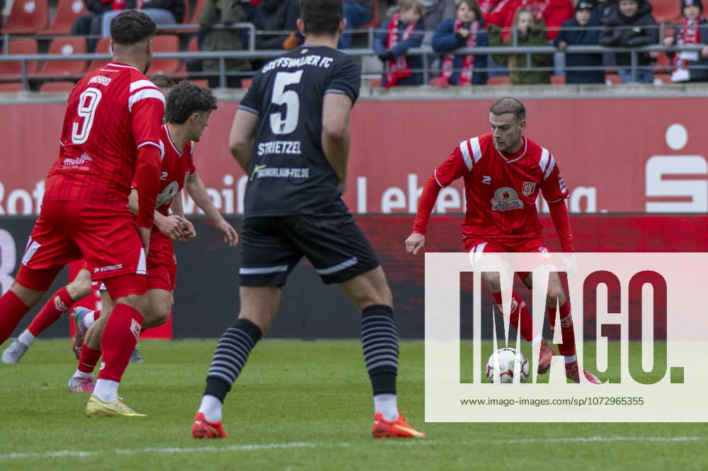 Regionalliga Nordost season 25 26 Hallescher FC vs Greifswalder FC Halle, Germany February 21, 2026 In the picture from left Malek Fakhro Halle , Joscha Wosz Halle , Bastian Strietzel Greifswald and Max Kulke Halle Halle Saale Leuna Chemie Stadion Sachsen Anhalt Germany