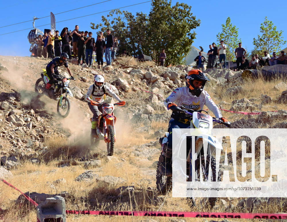 Motocross riders navigate a steep and rocky downhill path during the enduro championship Competitors test their skills on the rugged terrain maneuvering their bikes over loose stones and natural obstacles Erbil Iraq - ZUMAy105 20251017_zip_y105_011
