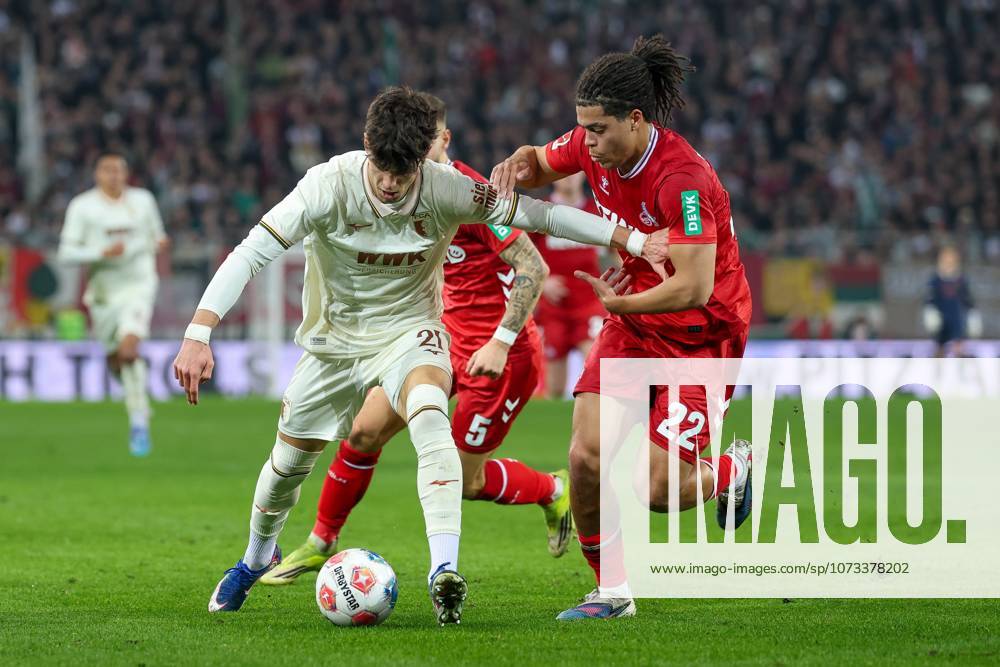 In duel, action, with Rodrigo Ribeiro 21 FC Augsburg , Jahmai Simpson Pusey 22 1 FC Koeln , FC Augsburg vs 1 FC Koeln, Football, 1 Bundesliga, 24 Matchday, 27 02 2026 DFB regulations prohibit any use of photographs as image sequences and or quasi video Augsburg Bayern Germany