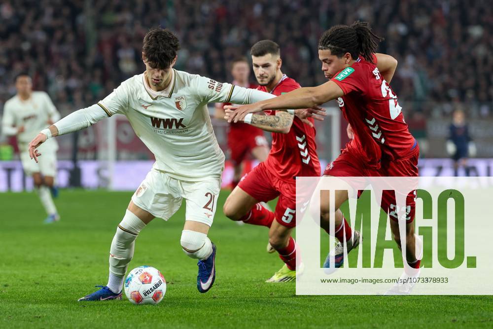 In duel, action, with Rodrigo Ribeiro 21 FC Augsburg , Jahmai Simpson Pusey 22 1 FC Koeln , FC Augsburg vs 1 FC Koeln, Football, 1 Bundesliga, 24 Matchday, 27 02 2026 DFB regulations prohibit any use of photographs as image sequences and or quasi video Augsburg Bayern Germany