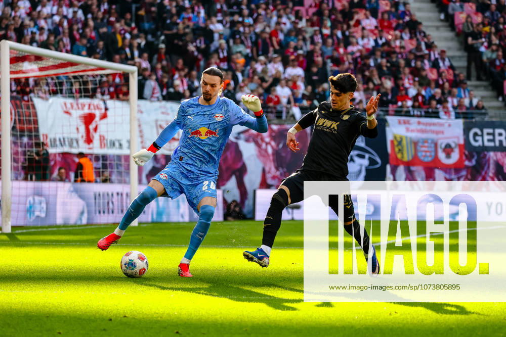 Maarten Vandevoordt RB Leipzig, 26 on the ball, duel, duel, fight against Rodrigo Ribeiro FC Augsburg, 21 , RB Leipzig vs FC Augsburg, Football, 1 Bundesliga, 25 Matchday, Season 2025 2026, 07 03 2026,¨ DFL REGULATIONS PROHIBIT ANY USE OF PHOTOGRAPHS AS IMAGE SEQUENCES AND OR QUASI VIDEO,¨ RB Leipzig vs FC Augsburg, Football, 1 Bundesliga, 25 Matchday, Season 2025 2026, 07 03 2026 Leipzig