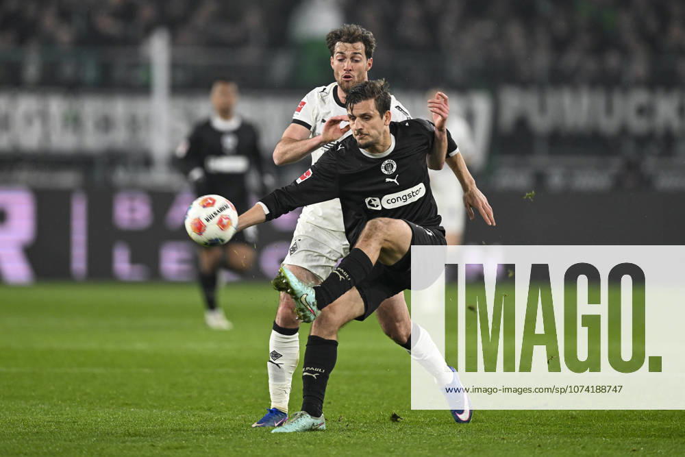 V li in duel Joe Scally Moenchengladbach 29 Adam Dzwigala Pauli 25 13 03 2026 ¢ Football ¢ Borussia Moenchengladbach vs FC St Pauli, Borussia Park, Moenchengladbach, DFB DFL REGULATIONS PROHIBIT ANY USE OF PHOTOGRAPHS AS IMAGE SEQUENCES AND OR QUASI VIDEO