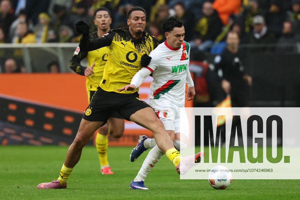Dortmund, Germany, 14 03 26, Felix Nmecha Borussia Dortmund and Fabian Rieder FC Augsburg in a duel during the match of the 1 Bundesliga between Borussia Dortmund FC Augsburg at the Signal Iduna Park in Dortmund Photo by Joachim Bywaletz DFB DFL REGULATIONS PROHIBIT ANY USE OF PHOTOGRAPHS AS IMAGE SEQUENCES AND OR QUASI VIDEO