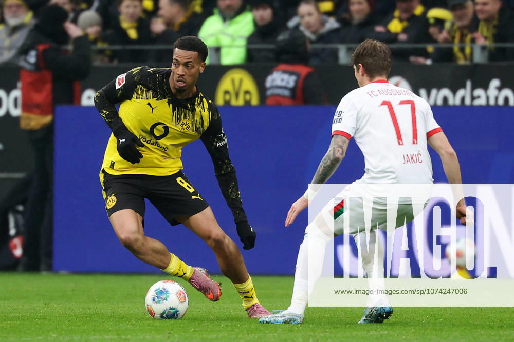 Dortmund, Germany, 14 03 26, Felix Nmecha Borussia Dortmund and Kristijan Jakic FC Augsburg in a duel during the match of the 1 Bundesliga between Borussia Dortmund FC Augsburg at the Signal Iduna Park in Dortmund Photo by Joachim Bywaletz DFB DFL REGULATIONS PROHIBIT ANY USE OF PHOTOGRAPHS AS IMAGE SEQUENCES AND OR QUASI VIDEO