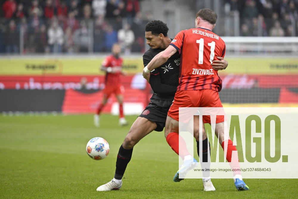 One-on-one, action Budu Zivzivadze Siwsiwadse 1 FC Heidenheim 1846 FCH 11 vs Jarell Quansah Bayer 04 Leverkusen 04 1 FC Heidenheim 1846 FCH vs Bayer 04 Leverkusen B04 21 03 2026 DFL REGULATIONS PROHIBIT ANY USE OF PHOTOGRAPHS AS IMAGE SEQUENCES AND OR QUASI VIDEO 1 FC Heidenheim 1846 FCH vs Bayer 04 Leverkusen