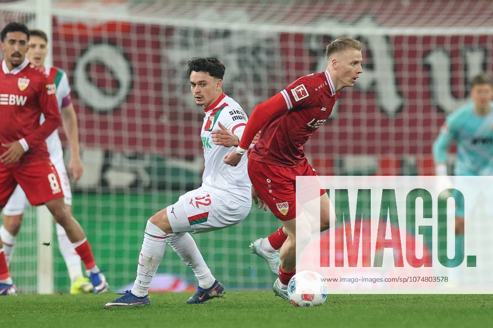 In duel, action, with Fabian Rieder 32 FC Augsburg , Chris Fuehrlich 10 VfB Stuttgart , FC Augsburg vs VfB Stuttgart, Football, 1 Bundesliga, 27 Matchday, 22 03 2026 DFB regulations prohibit any use of photographs as image sequences and or quasi video Augsburg Bayern Germany
