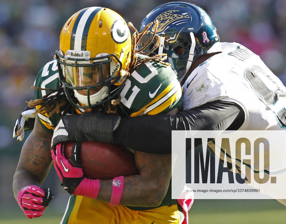 Oct. 28, 2012 - Green Bay, WI, USA - Green Bay Packers running back Alex Green is stopped by Jacksonville Jaguars Jeremy Mincey durng the waning moments of the fourth quarter at Lambeau Field in Green Bay, Wisconsin, Sunday, October 28, 2012. The Packers beat the Jaguars, 25-15.