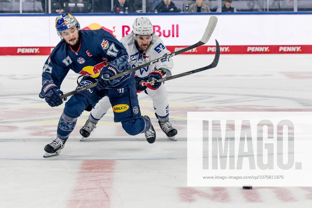 Battle for the puck duel between Taro Hirose EHC Red Bull Muenchen, 17 and Kris Bennett Adler Mannheim, 21 GER, EHC Red Bull Muenchen vs Adler Mannheim, ice hockey, DEL, playoffs, semi-final game 2, 2025 2026 season, 10 04 2026 GER, EHC Red Bull Muenchen vs Adler Mannheim, ice hockey, DEL, playoffs, semi-final game 2, 2025 2026 season, 10 04 2026 Muenchen