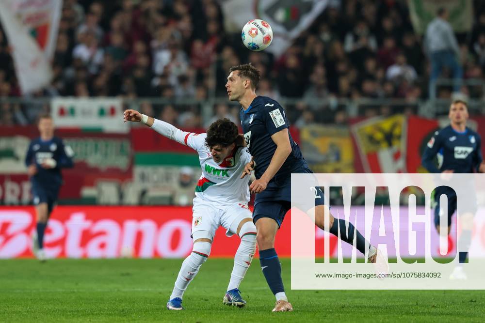 In duel, action, with Rodrigo Ribeiro 21 FC Augsburg , Robin Hranac 2 TSG 1899 Hoffenheim , FC Augsburg vs TSG 1899 Hoffenheim, Football, 1 Bundesliga, 29 Matchday, 10 04 2026 DFB regulations prohibit any use of photographs as image sequences and or quasi video Augsburg Bayern Germany