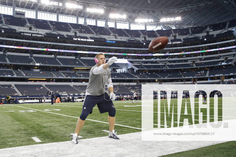 Houston Texans defensive end J.J. Watt (99) throws passes with fans before the NFL, American Football Herren, USA game between the Houston Texans and the Dallas Cowboys at AT&T Stadium in Arlington, TX.