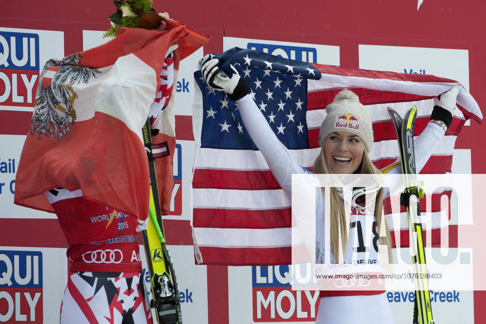 Feb. 3, 2015 - Beaver Creek, Colorado, U.S - LINDSEY VONN of the United States (right), laughs as she watches ANNA FENNINGER of Austria (left), wrap the Austrian flag around herself during the podium ceremony for the Ladies Super G during the FIS Alpine World Ski Championships. VONN finished in third place, while FENNINGER finished in first place.