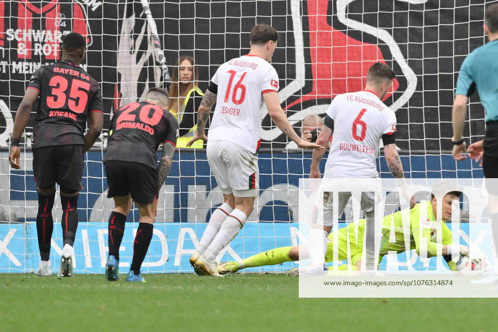Goalkeeper Finn Dahmen FC Augsburg in action, left Jeffrey Gouweleeuw FC Augsburg , Cedric Zesiger FC Augsburg , Alejandro Grimaldo Bayer 04 Leverkusen , Christian Kofane Bayer 04 Leverkusen 18 04 2026, Soccer 1 Bundesliga, Season 2025 2026, Matchday 30, Bayer 04 Leverkusen FC Augsburg 1 2 DFL regulations prohibit any use of photographs as image sequences and or quasi video Leverkusen BayArena Nordrhein Westfalen Germany Team2