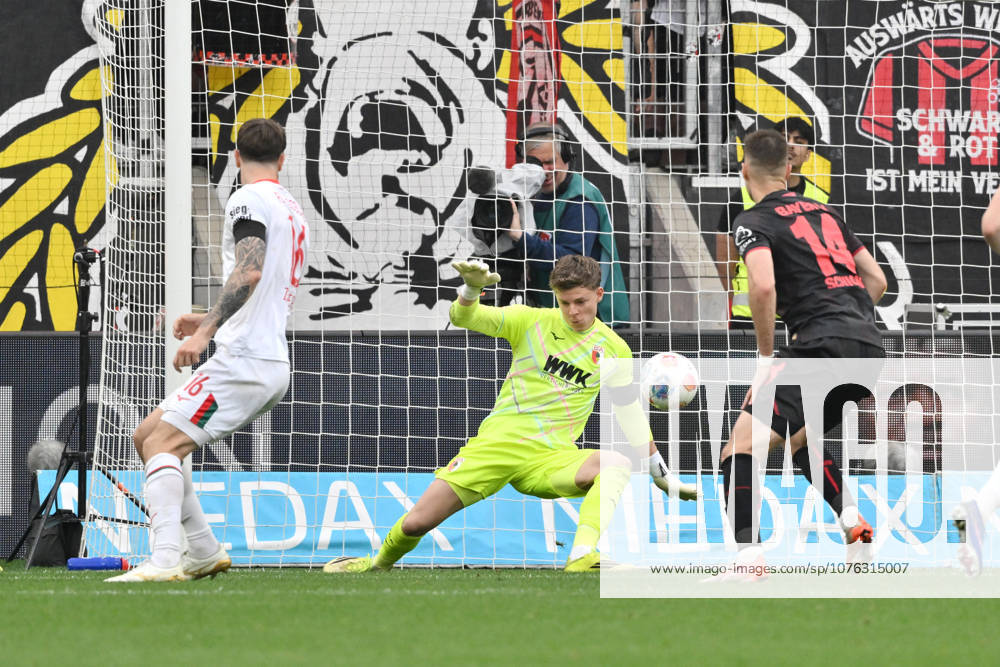 Goalkeeper Finn Dahmen FC Augsburg in action, right Patrik Schick Bayer 04 Leverkusen 18 04 2026, Soccer 1 Bundesliga, Season 2025 2026, 30 Matchday, Bayer 04 Leverkusen FC Augsburg 1 2 DFL regulations prohibit any use of photographs as image sequences and or quasi video Leverkusen BayArena Nordrhein Westfalen Germany Team2