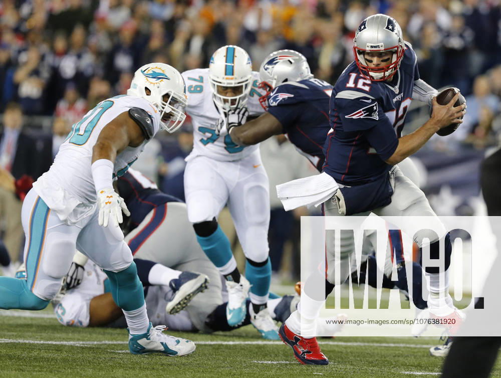 Oct. 29, 2015 - Foxborough, MA, USA - New England Patriots quarterback Tom Brady (12) scrambles in the backfield against the Miami Dolphins at Gillette Stadium in Foxborough, Mass., on Thursday