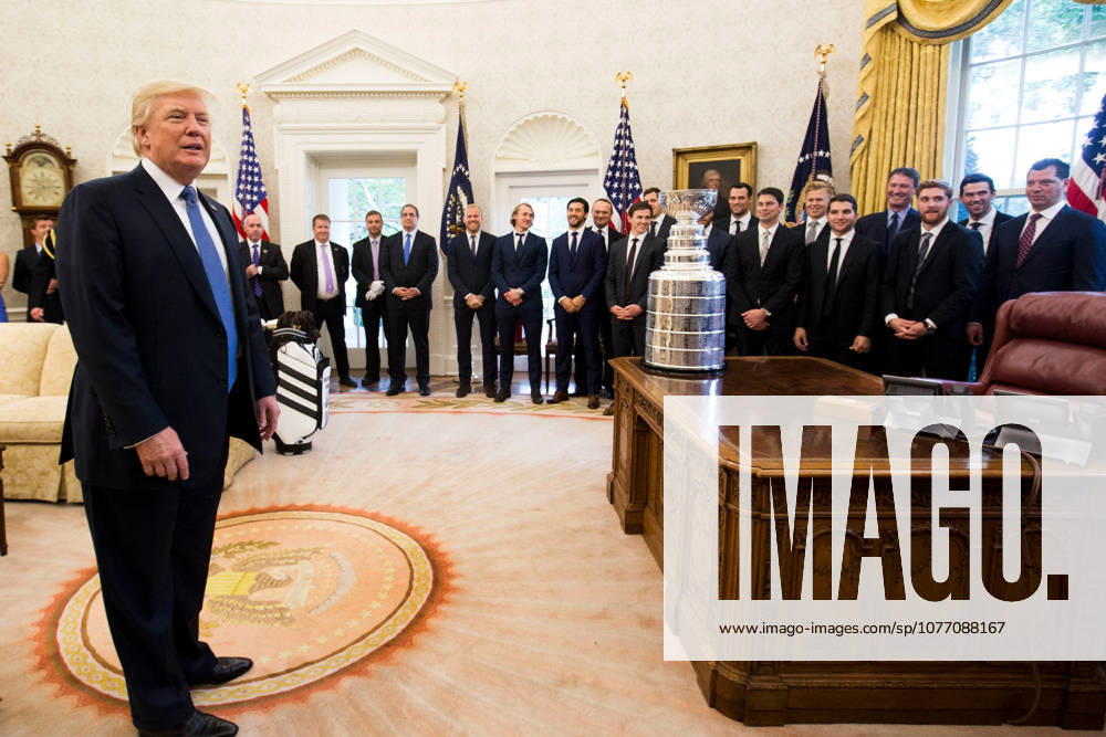 Washington, DC, United States of America - U.S. President Donald Trump hosts the 2016 Stanley Cup Champion Pittsburgh Penguins in the Oval Office of the White House October 10, 2017 in Washington, D.C.