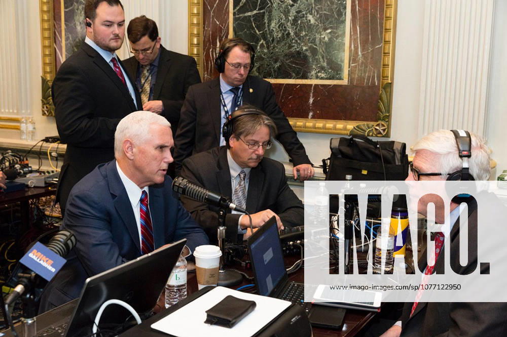 Washington, DC, United States of America - U.S. Vice President Mike Pence speaks with conservative radio talkshow host Hugh Hewitt, right, as the White House hosts a talk radio row in the Old Executive Office Building October 17, 2017 in Washington, DC. The Trump administration is hoping to appeal directly to his grassroots through conservative talk radio to push for his tax reform program.