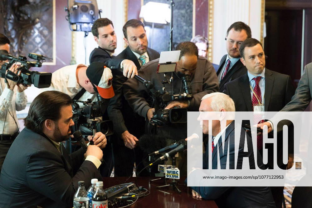Washington, DC, United States of America - U.S. Vice President Mike Pence speaks with conservative radio talkshow host Tony Katz, left, as the White House hosts a talk radio row in the Old Executive Office Building October 17, 2017 in Washington, DC. The Trump administration is hoping to appeal directly to his grassroots through conservative talk radio to push for his tax reform program.