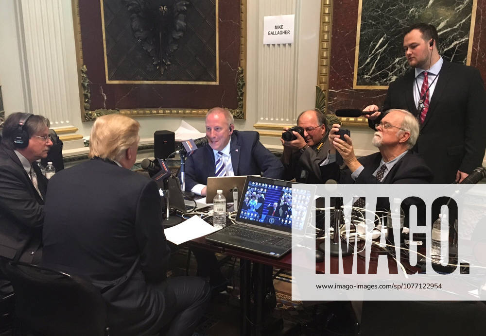 Washington, DC, United States of America - U.S. President Donald Trump speaks with conservative radio talkshow host Mike Gallagher as the White House hosts a talk radio row in the Old Executive Office Building October 17, 2017 in Washington, DC. Trump is hoping to appeal directly to his grassroots through conservative talk radio to push for his tax reform program.