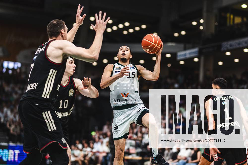 Jordan Roland Gladiators Trier in a duel with Justinian Jessup FC Bayern Muenchen Basketball and Johannes Voigtmann FC Bayern Muenchen Basketball , Vet Concept Gladiators Trier vs FC Bayern Muenchen Basketball, Basketball, easyCredit BBL, Playoffs, Quarterfinals, Game 3, Season 2025 2026, 23 05 2026 Vet Concept Gladiators Trier vs FC Bayern Muenchen Basketball, Basketball, easyCredit BBL, Playoffs, Quarterfinals, Game 3, Season 2025 2026