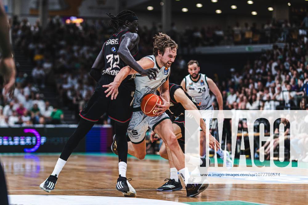 Marco Hollersbacher Gladiators Trier in duel with Wenyen Gabriel FC Bayern Muenchen Basketball , Vet Concept Gladiators Trier vs FC Bayern Muenchen Basketball, Basketball, easyCredit BBL, Playoffs, Quarterfinals, Game 3, Season 2025 2026, 23 05 2026 Vet Concept Gladiators Trier vs FC Bayern Muenchen Basketball, Basketball, easyCredit BBL, Playoffs, Quarterfinals, Game 3, Season 2025 2026