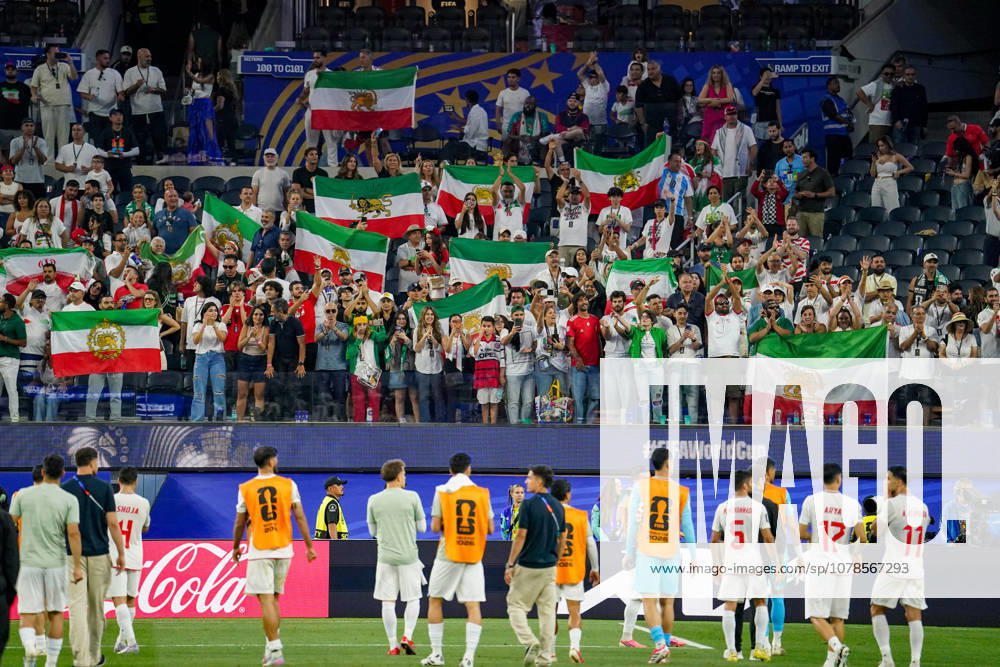 USA Soccer 2026 FIFA World Cup Group Stage Group G Iran vs. New Zealand SoFi Stadium, Inglewood, Los Angeles County, California Iranian fans celebrate their team after the match, with many displaying the historic Lion and Sun flag The pre-revolutionary flag is considered a symbol of the Iranian opposition and is used by many Iranians in exile The motif represents fan culture, the Iranian diaspora, political identity, and solidarity in the context of the 2026 FIFA World Cup,detected_source_language