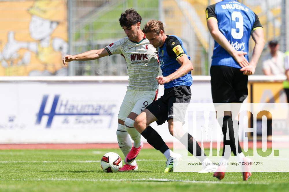 One-on-one, Action, with Rodrigo Ribeiro 21 FC Augsburg 9 FC Augsburg, Siemen Voet 4 1 FC Saarbrücken, FC Augsburg vs. 1 FC Saarbrücken, Soccer, 1st Bundesliga, Friendly Match, 2026–27 Season, July 25, 2026, Kaufbeuren, Bavaria, Germany