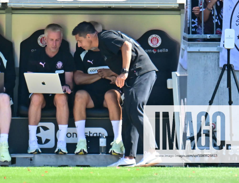 GER Soccer, Men, 2nd Division, Matchday 1, 2026–2027 Season, Hamburg, FC St. Pauli vs. SpVgg Greuther Fürth Coach Marcel Rapp of St. Pauli talks with assistant coach Jens Schuster. St. Pauli. DFB and DFL regulations prohibit any use of photographs as image sequences and or quasi-video. Hamburg, Millerntorstadion, Hamburg, Germany